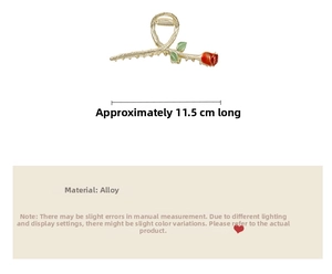 Detail of 11.5cm gold alloy hair claw clip with red rose and green leaf design