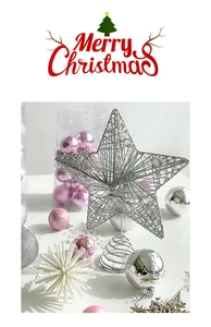 Macro shot of silver glittered hollow star tree topper with spiral metal base