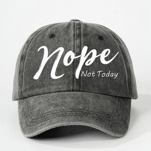 Close-up of washed gray baseball cap featuring white Nope Not Today printed text