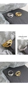 Close-up of S925 sterling silver thorn rings in gold and silver with vine texture
