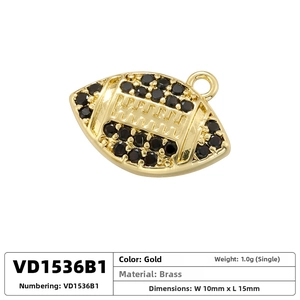 Detailed view of rugby shaped gold pendant with black zircon inlays 10mm by 15mm