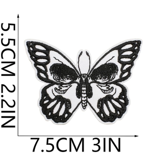 Detailed view of black and white butterfly embroidery patch with dimensions 7.5cm x 5.5cm