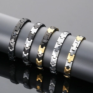 Close-up of men's tungsten steel bracelets with geometric H-link and magnetic elements