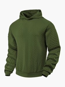 Details des dunkelgrünen Herren-Hoodies mit geometrischer Waffelstruktur und Rippbündchen