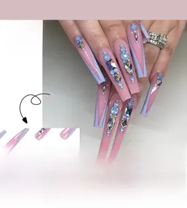 Long coffin false nails with pink and blue French tips adorned with iridescent rhinestones