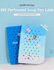 Close-up of DIY silicone pencil case with removable bear and bow decorative buttons