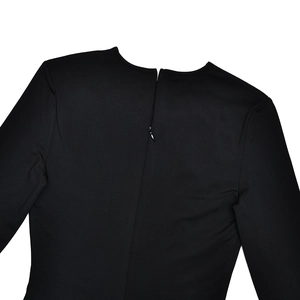 Close-up of a seamless invisible back zipper on a high-stretch black long sleeve dress