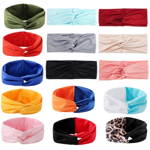 Detail showcasing variety of colors and patterns of twisted elastic yoga headbands