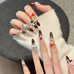 Handmade Christmas press-on nails with 3D snowman, chocolate cake design and silver trees