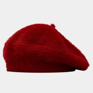 Detailed macro shot of the fluffy long-pile red faux mink plush beret fabric texture