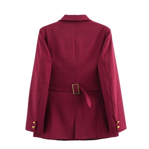 Detail view of burgundy plaid blazer back showing golden sleeve buttons and waist strap buckle