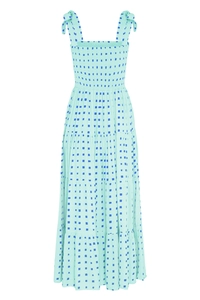 Detail of smocked bodice and adjustable tie straps on mint green tiered maxi dress