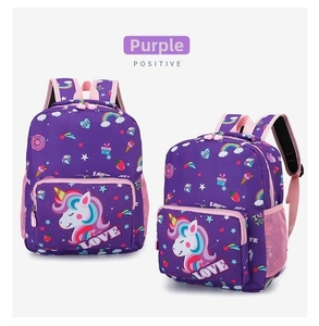 Detail view of purple unicorn kids backpack with rainbow embroidery and pink mesh side pocket
