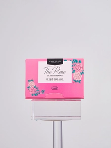 Detail view of Maycreate rose fragrance oil absorbing paper in pink floral packaging