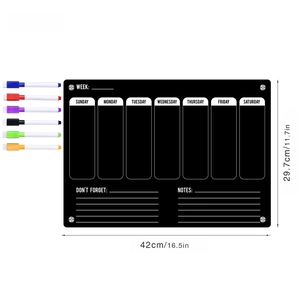 Macro view of black acrylic weekly calendar board with six colorful magnetic pens