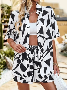 Detail shot of summer two-piece set featuring black and white geometric print and drawstring