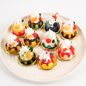 Set of 10 realistic miniature dessert cakes with fruit toppings on gold trays