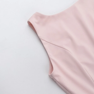 Close-up of high-quality sewing craft and armhole stitching on this pink sleeveless dress