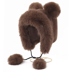 Dark brown faux fur winter hat with plush earflaps and cute pom-pom ears on a metal stand