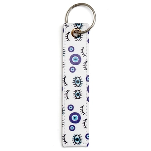 Detailed close-up of Evil Eye faux leather keychain with blue patterns and metal ring