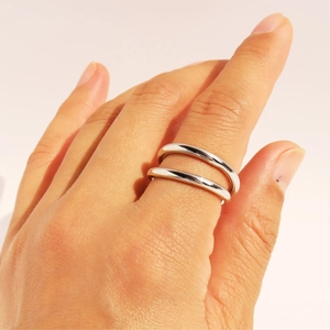 Double-layer crisscross silver metal ring for women with a minimalist polished finish