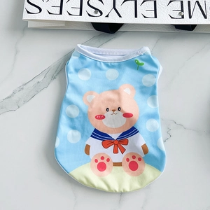 Detailed view of light blue mesh puppy vest with cartoon bear and nautical patterns