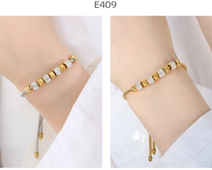 Detail of gold snake chain bracelet with alternating silver pave-set crystal bead accents