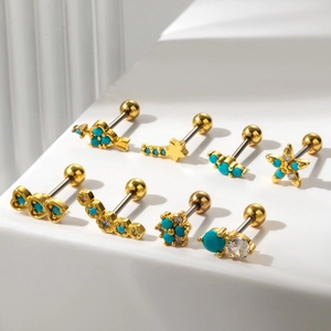 Set of gold stainless steel cartilage studs with turquoise stones and star designs