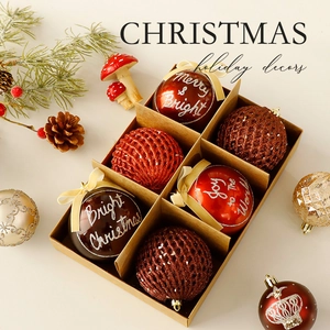 Christmas ornament set with red gold baubles and pine needles in festive box