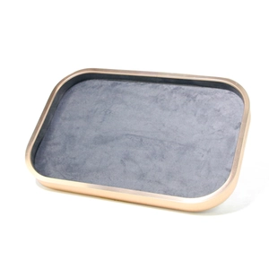 Close-up of champagne gold metal jewelry tray with premium grey microfiber lining