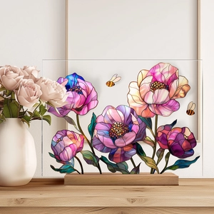 Close-up of pink and purple floral acrylic plaque with a solid wooden base