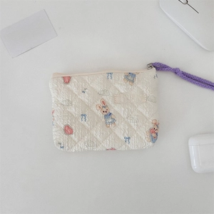 Quilted floral coin purse with cute rabbit pattern and purple wrist strap detail