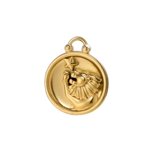Macro view of 18K gold Leo zodiac charm with embossed lion and star detail