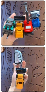 Mini alloy excavator keychain set in bright colors shown with car key attachment