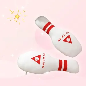 Detail of creative plush bowling pin toy with red stripes and bowling print text