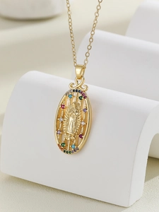 Detail of gold oval Virgin Mary pendant with colorful pavé cubic zirconia setting