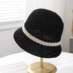 Stylish black knitted bucket hat for women with elegant white hollow lace trim