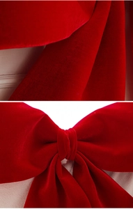Close-up of red velvet Christmas bow showing premium fabric texture and craftsmanship