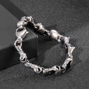 Detailed close-up of a silver-polished boxing glove link bracelet on a display box