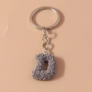 Fashionable keychain with resin letter D featuring intricate rose textures and silver metal chain