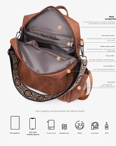 Detail view of large capacity vintage backpack interior showing compartments and A4 storage