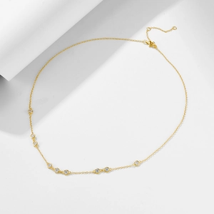 Detailed view of gold plated 925 silver necklace with sparkling round zircon stones