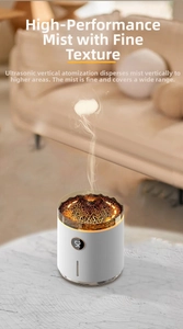 Detail of ultrasonic volcano diffuser showing LED display and vertical mist on marble surface