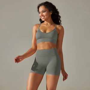 Close-up of grey-green seamless knitted sports bra and high-waisted shorts set