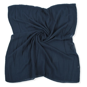 Detailed view of dark blue crinkle cotton linen scarf showing spiral pleated texture