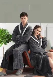 Detailed texture of thick dark grey pineapple flannel bathrobe with white fleece collar