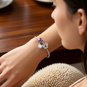 Elegant vintage silver butterfly cuff bracelet featuring purple zircon and pearl shell detail