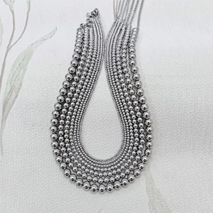 Polished silver stainless steel bead necklaces in various sizes with lobster clasps