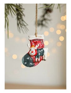 Close-up of a resin hand-painted reindeer inside a red Christmas stocking ornament