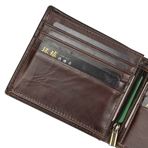 Close-up of genuine leather wallet with multiple card slots and metal zipper pocket